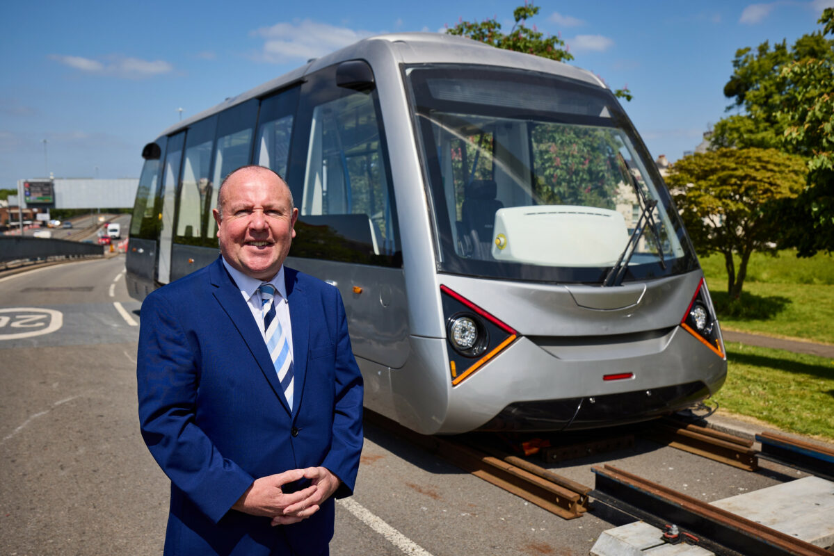 Coventry Councillor Jim O'Boyle with the city's recently unveiled Very Light Railway to decarbonise public transport. Image: Coventry City Council Flickr