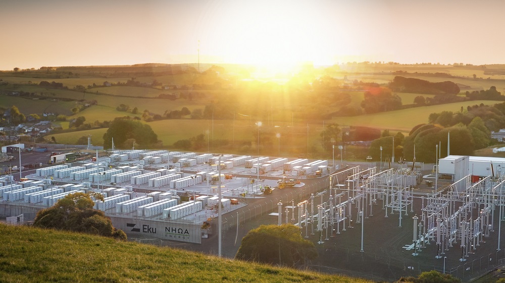 A bright sun shines over a battery storage site using NHOA's battery technology