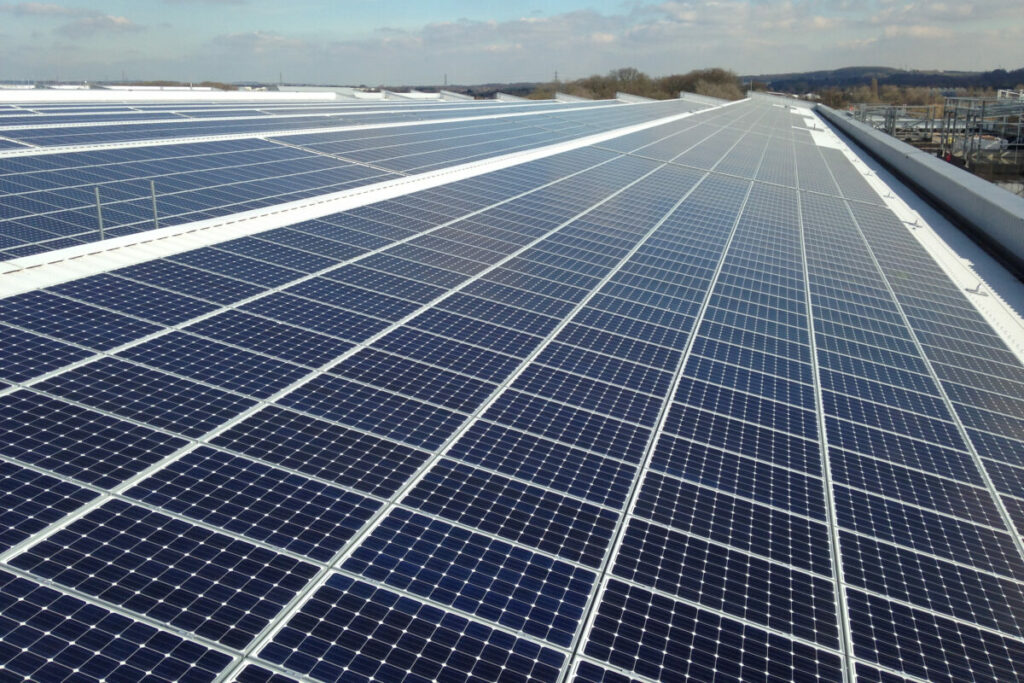 Image of rooftop Solar PV modules mounted on a commercial building