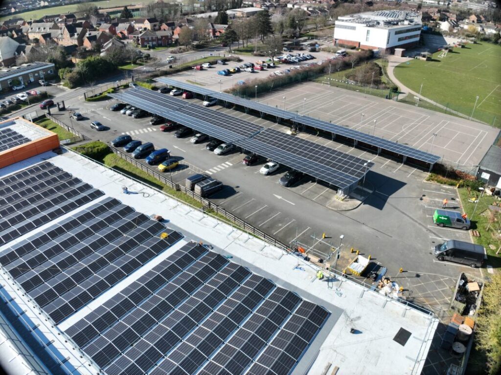 rooftop solar panels and a solar carport as seen from above