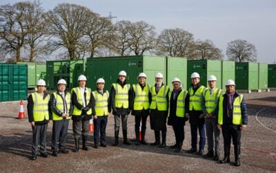 PEOPLE IN HIGH VIS STAND BY BESS UNITS
