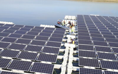 Solar panels float on blue grey water