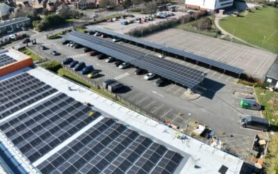 rooftop solar panels and a solar carport as seen from above