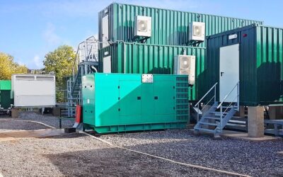 Green BESS units stacked on top of each other