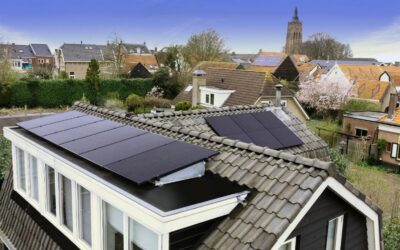 Residential rooftops with solar panels installed.