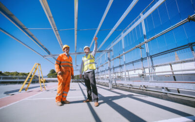 SunGift_founder_Gabriel_Wondrausch_right_showing_off_the_structure_of_the_citys_ground-breaking_solar_carports