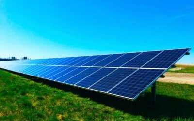 Solar panels under an oversaturated blue sky