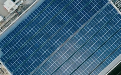 a top down view of solar panels on a commercial rooftop
