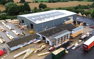 A factory with solar pv cells on the roof, shot from above