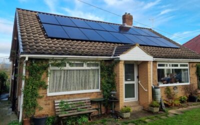 A bungalow with solar panels on the roof