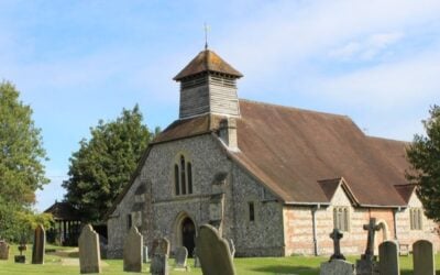 A church building behind a graveyard