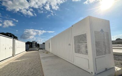 a series of bess units under a blue sky