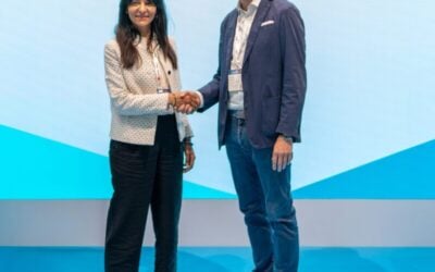 BNP Paribas' Ouafae Cohin (left) and Segen's Nicolas Niedhart shake hands at Intersolar Europe 2025.