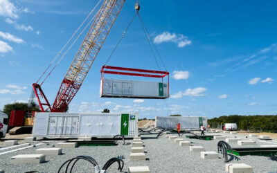 Cranes moving battery storage elements during the construction of Sheaf Energy Park - a Pacific Green battery energy storage (BESS) project in Kent.